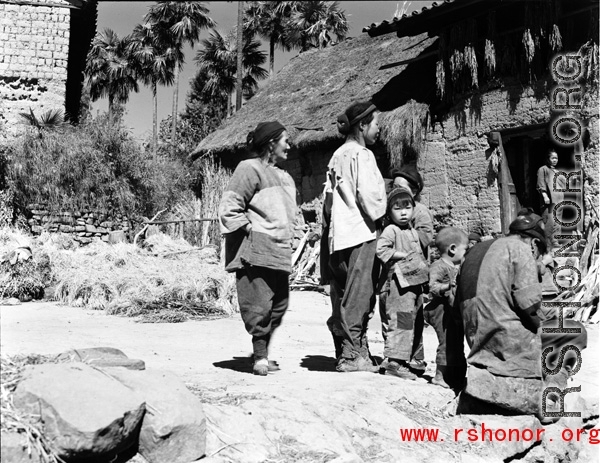 Local people in a village in China, probably Yangkai village, Yunnan province.