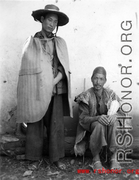 Local people in Yunnan province, China, during WWII.  The man on the left is wearing typical clothing of the Yi ethnic group.  From the collection of Eugene T. Wozniak.