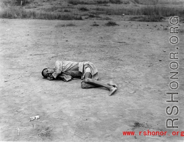 The sick and weakened during the Chinese civilian evacuation in Liuzhou city Guangxi province, China, during WWII, during the summer or fall of 1944 as the Japanese swept through as part of the large Ichigo push.