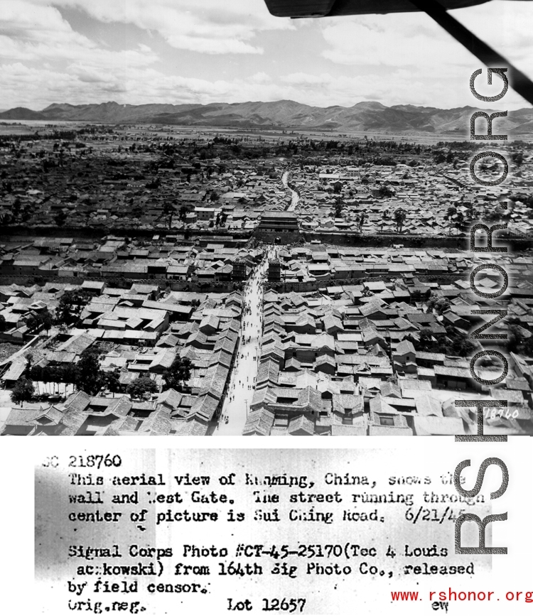 During WWII, this aerial view of Kunming, China, shows the wall and West Gate.  The street running through center of picture is Sui Ching Road.  6/21/1945