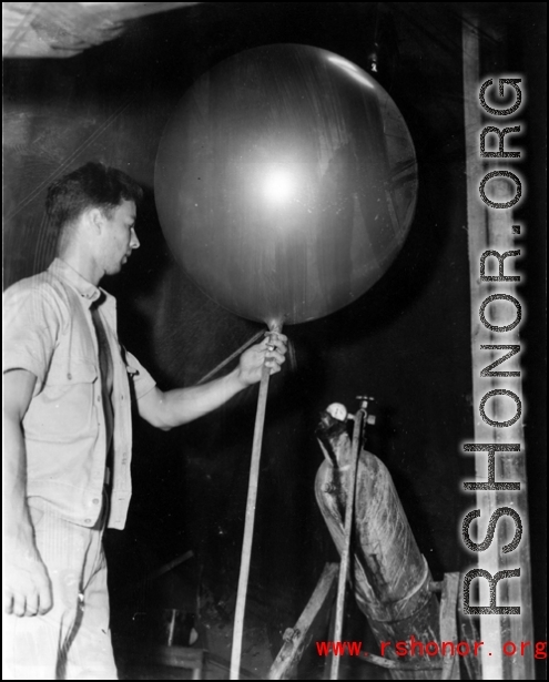 A balloon being filled with helium or hydrogen, probably as part of some kind meteorological measurement, during WWII in the CBI.