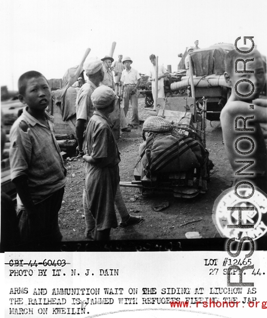 September 27, 1944  During WWII, arms and ammunition wait on the siding at Liuchow as the railhead is jammed with refugees fleeing the Japanese march on Kweilin (Guilin).