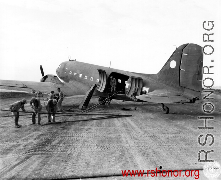 Preparing fence to stable mules before a flight on a C-47, 1944, Burma, 10AF, during WWII.  10th Army Air Force.