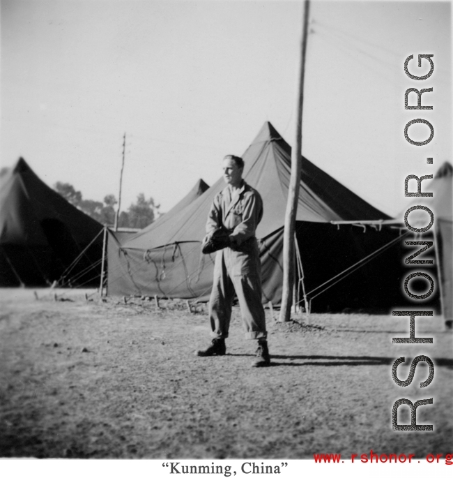 GI with mitt playing baseball at a tent city in Kunming, China, during WWII.