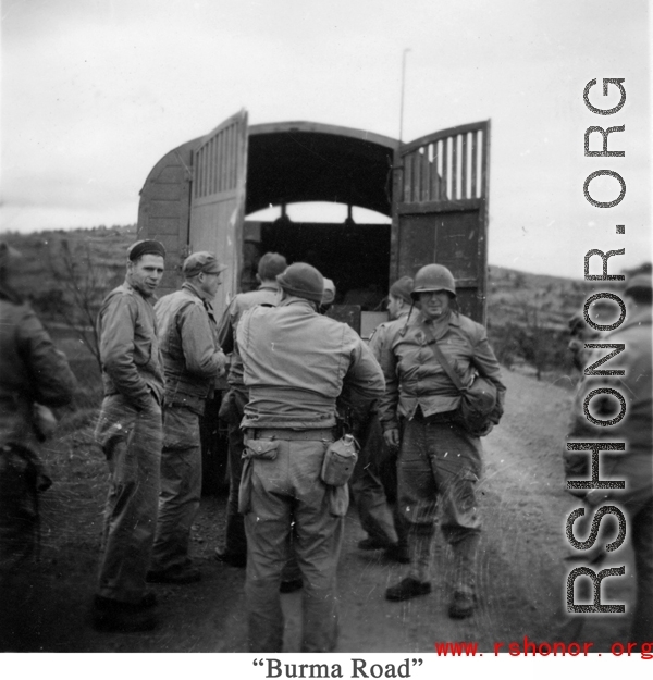 American GIs stop along the Burma Road on a cool day during WWII.