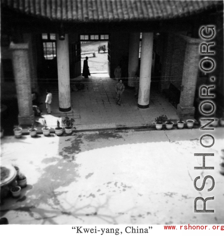 An American soldier walks in a quiet courtyard somewhere in Guizhou province, probably Anshun city or Guiyang (Kweiyang) city.  Since Guiyang was the capital of Guizhou, Americans often used that name for the whole province.