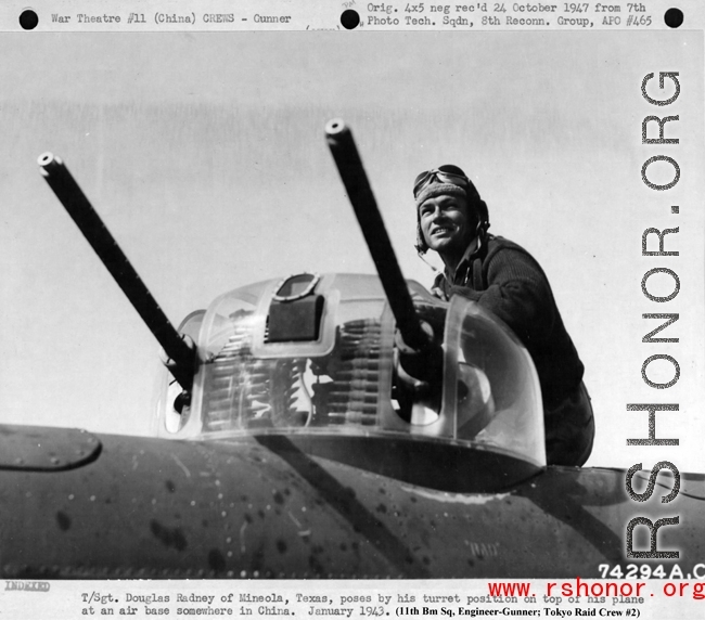 During WWII, T/Sgt. Douglas V. Radney of Mineola, Texas, poses by his turret position on top of his plane at an air base somewhere in China. January 1943. (Douglas Radney was an Engineer-Gunner; Doolittle Tokyo Raid crew #2)  Mr. Radney passed away in 1994. 