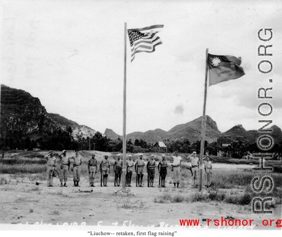 "Liuchow (Liuzhou)--retaken, first flag raising."  I In 1945, Chinese and Americans salute as two flags are raised in Liuzhou airbase, Guangxi province, China, during WWII.