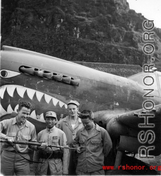 T.T. Hale, S. Seidler, G. Feldman at Guilin (Kwelin) base, in Guangxi province, China, during the Second World War in front of a P-40.  Selig Seidler was a member of the 16th Combat Camera Unit in the CBI during WWII.