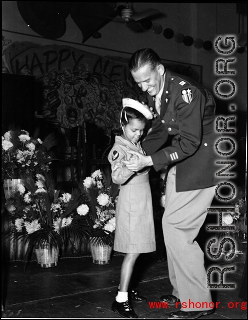 GI and charming girl dancing in India during WWII.