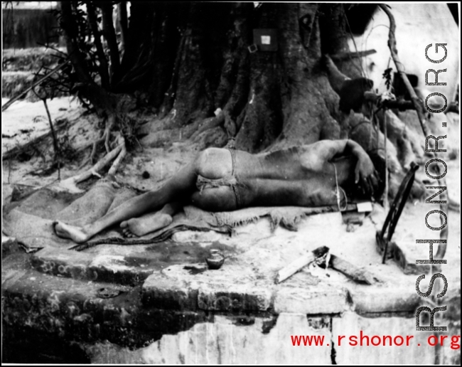 A man sleeps under a banyan tree in India during WWII.  In the CBI. Photo submitted by Glenn S. Hensley, Kirkwood, MO.