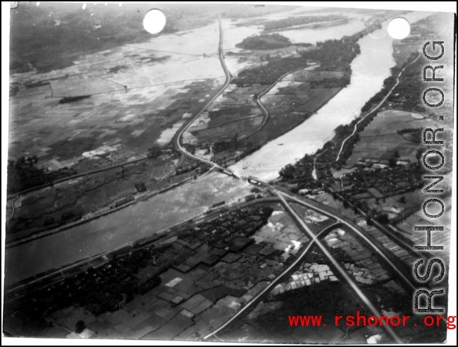 Aerial view of bombed bridge in SW China or French Indochina during WWII.