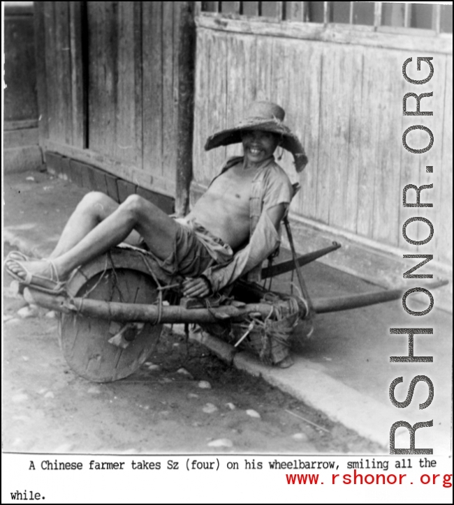 Farming in China: Farmer resting on wheelbarrow.