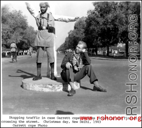 Garrett Cope accompanies a traffic policeman in New Delhi on Christmas Day, 1943.  Photo from Garrett Cope.