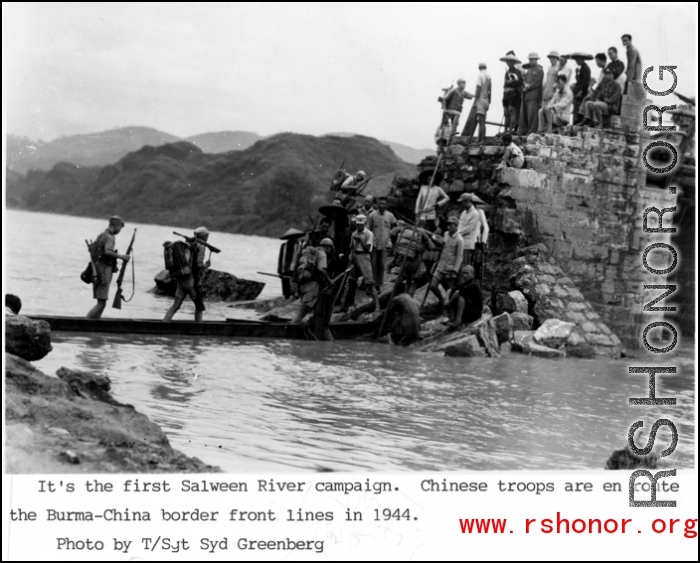 Chinese troops cross walkway (actually a long flat bottom boat) above water en route to Burma-China border front lines of the Salween River Campaign in 1944.  Photo from T/Sgt. Syd Greenberg.