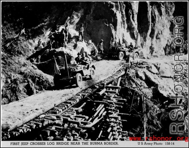 First jeep crosses log bridge near the Burma border.   U. S. Army phot