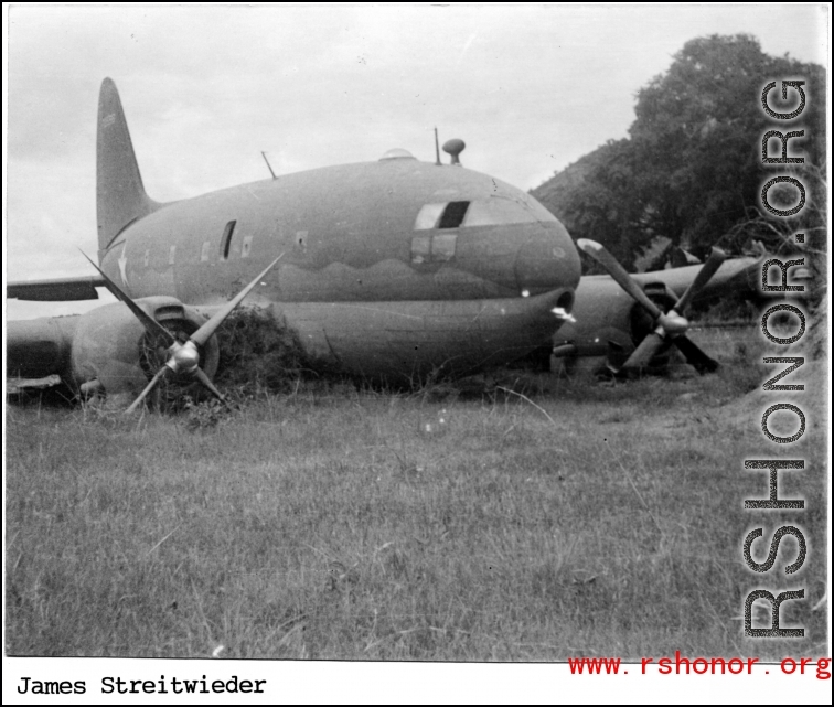 A C-46 hard on its belly in the CBI during WWII.  Photo from James Streitwieder.