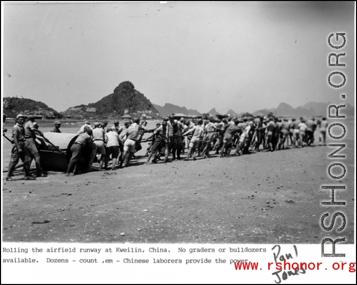 Chinese laborers pull a heavy roller on a runway at an American airbase at Guilin (Kweilin), China, during WWII.  From Paul Jones.