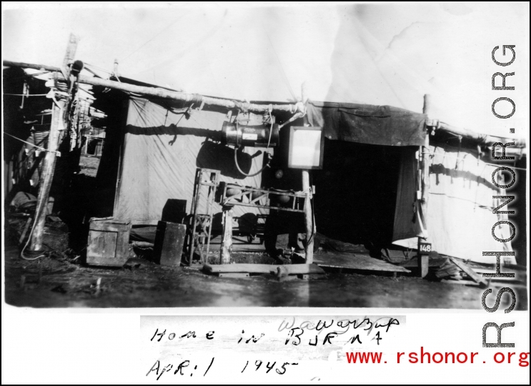 Unique GI accommodations--combination tent and miscellaneous spare parts--at Warazup, Burma. April 1945.