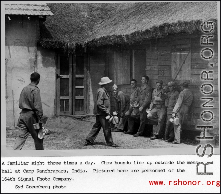 Mess line at Camp Kanchrapara, India. Here are personnel of the 164th Signal Photographic Company.  Photo by Syd Greenberg.