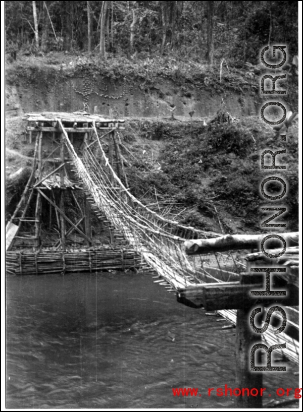 Pedestrian foot-bridge over water in the CBI during WWII.