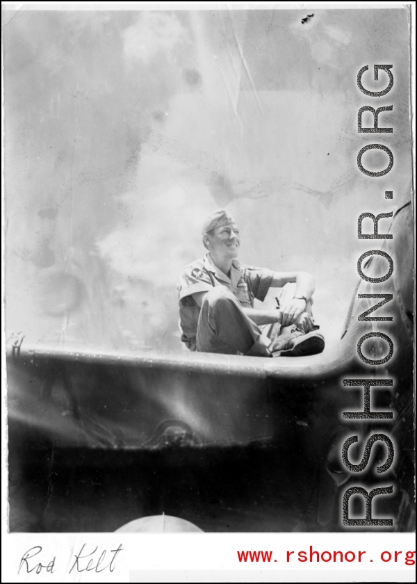 A GI sits on the wing of an airplane in the CBI during WWII. "Rob Kelt"