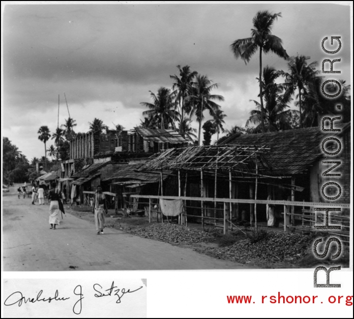 A roadside village in Burma or India during WWII.