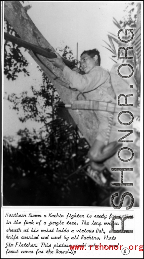 A Kachin fighter in a tree in northern Burma.  Photo from Jim Fletcher.