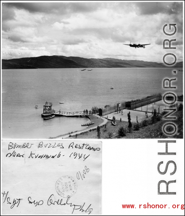 A P-38 buzzes the Camp Schiel rest camp in Yunnan, China, during WWII. 1944.  Photo by Syd Greenberg.