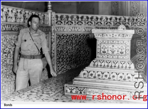 A GI examines an ornate tomb in India during WWII.  Photo from Bonds.