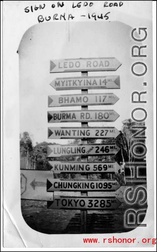 Heavily loaded sign post along Ledo Road, Burma, 1945.