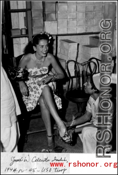 Jinx Falkenburg getting shoe fitted in Calcutta, India, in 1944 or 1945, USO troupe.