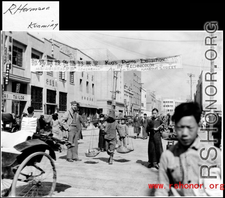 Busy street in Kunming during WWII, with GI taking it all in.  Photo from R. Hermann.