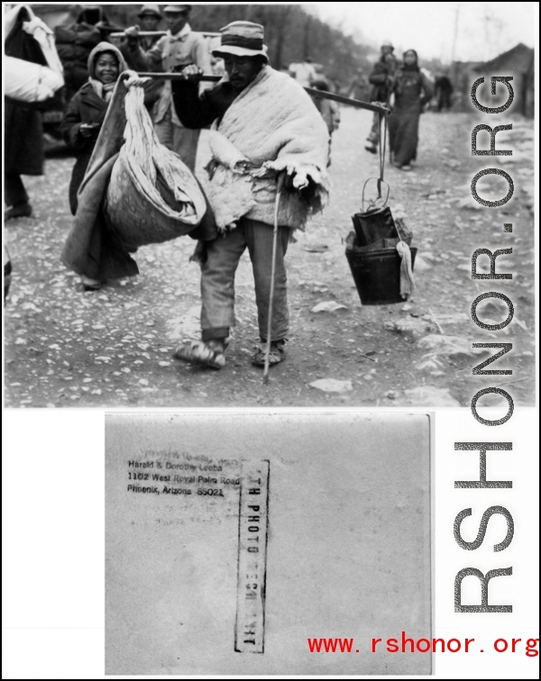 A Chinese man carries his possessions on a shoulder pole in the CBI during WWII.