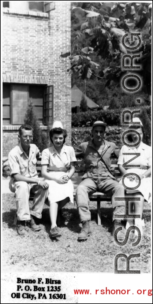 Nurses and GIs pose on a bench for the camera in the CBI during WWII.  Photo from Bruno F. Birsa.