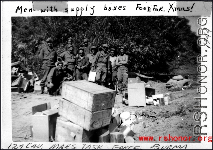 Mars Task Force 124th Cavalry Regiment enjoying supply boxes. For food Christmas in 1944! In Burma during WWII.