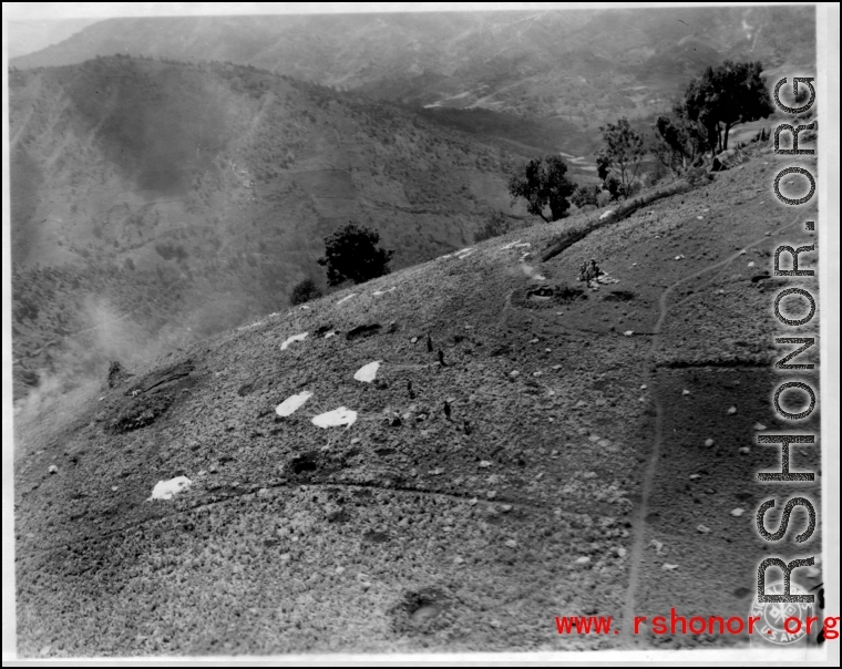 Allied airdrop on a hillside in SW China (or Burma), during WWII.  Image provided by Emery and Beth Vrana.