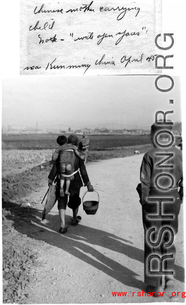 Chinese mother carries baby near Kunming, April 1945.