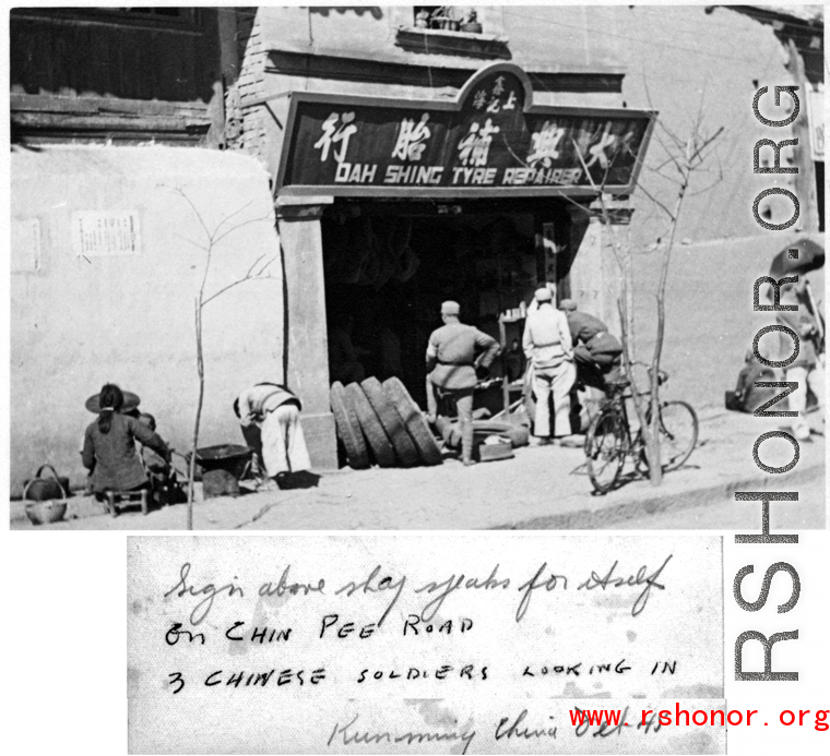 Chinese soldiers looking on at tire shop in Kunming, China, October 1945.