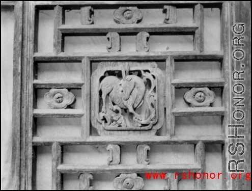 A carved wooden door panel in China. During WWII.  From the collection of Frank Bates.