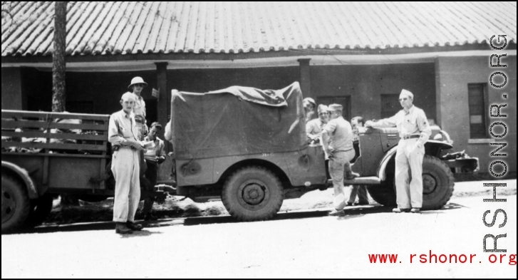 William Butler, Wayne Crusan, Trombley, Derby, Frenchy Beaudetter, Daggett. Outside base office buildings.  Probably at Yangkai.  From the collection of Frank Bates.