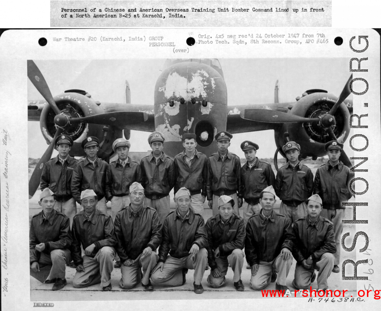 Personnel of a Chinese and American Overseas Training Unit Bomber Command lined up in front of a North American B-25 Mitchell at Karachi, India.