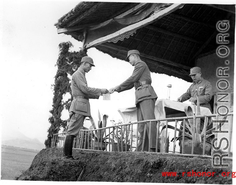 Chinese soldier of the 48th Army Division (陆军第四十八师) gets an award in a ceremony during a rally.