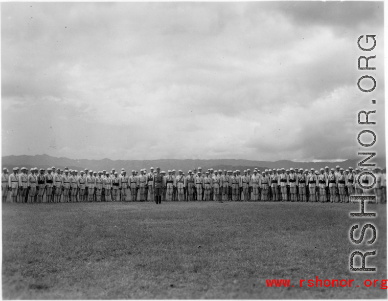 Chinese soldiers stand in ranks during exercises in southern China, probably Yunnan province, or possibly in Burma.