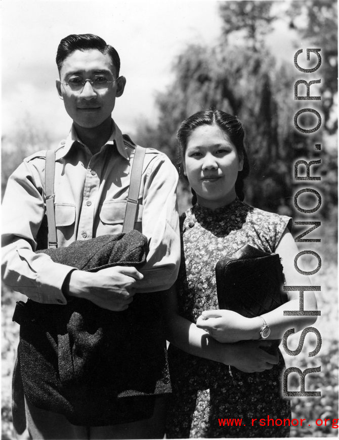 VIP Chinese couple pose for the camera on day outing.