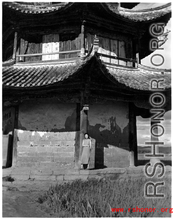 A VIP Chinese woman poses at a pavilion in Songming county during a day outing. During WWII.