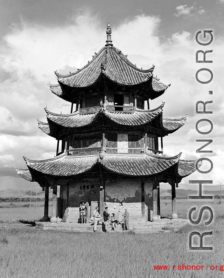 Western and Chinese friends chat at a pavilion in Songming county during WWII.