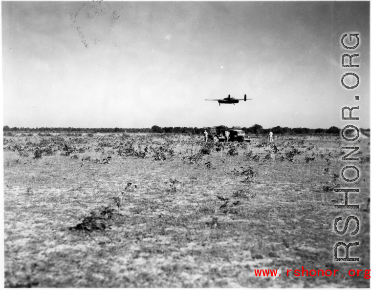 An American B-25 bomber flies at minimum altitude, probably during training / practice of 'low-level attack techniques', for 'skip bombing'.   B-25 pilots of the Tenth Air Force (341st Bomb Group) and Chinese-American Composite Wing (1st Bomb Group) were trained in 'skip bombing' in India during 1943 and 1944.