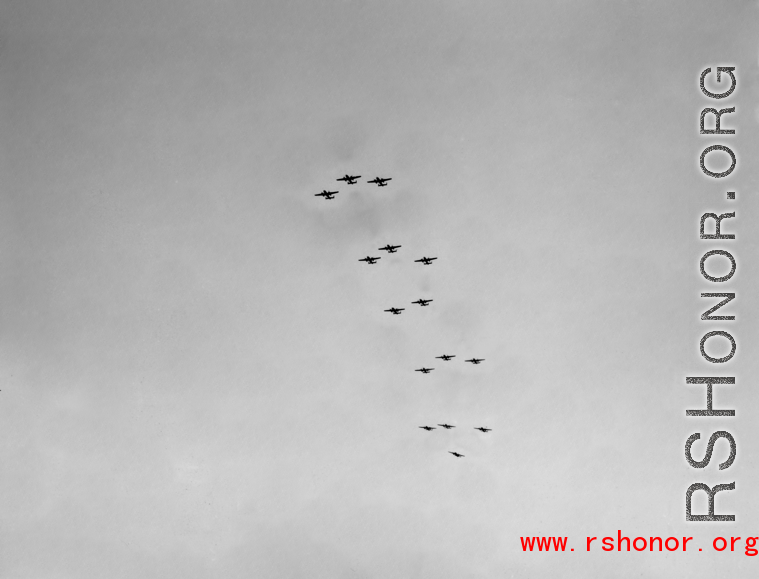 B-25 Mitchell bombers above in flight in the CBI, in the area of southern China, Indochina, or Burma.