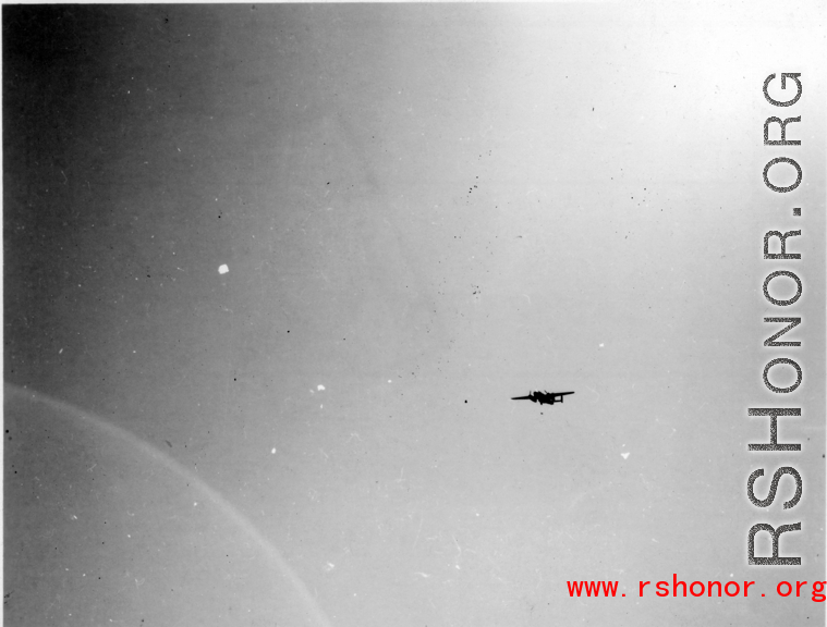 B-25 Mitchell bomber in flight in the CBI, in the area of southern China, Indochina, or Burma. During WWII.